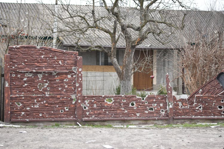 Damaged Wall Near House