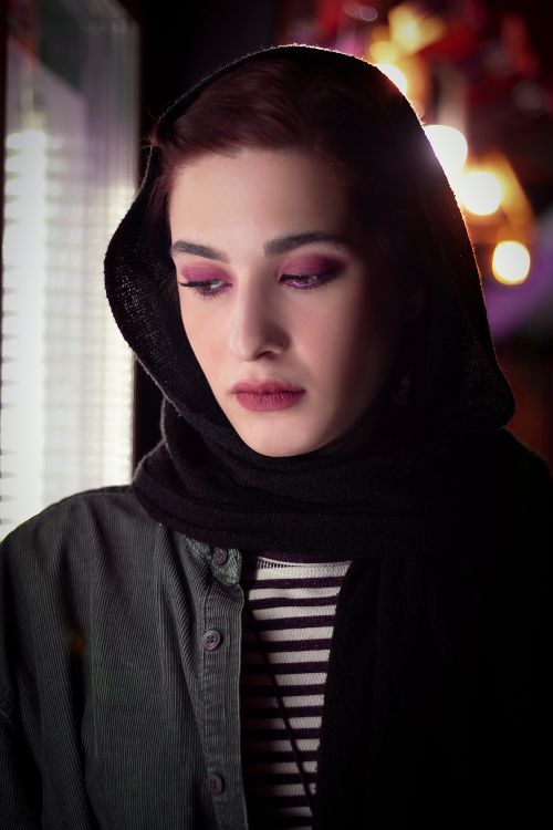 Free Elegant portrait of a woman with headscarf, highlighting thoughtful mood, Tehran, Iran. Stock Photo