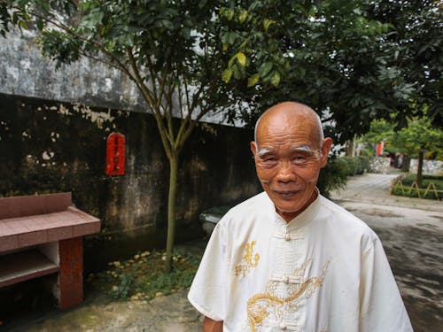 Portrait of a Man Standing Outside