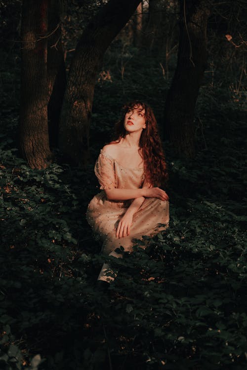 Redhead Girl in a Dress in Forest 