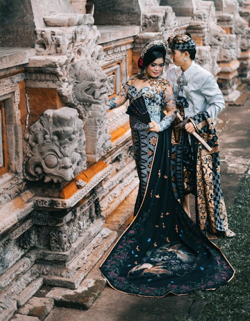 Photography of Woman in Black and Blue Lace Dress Beside Man