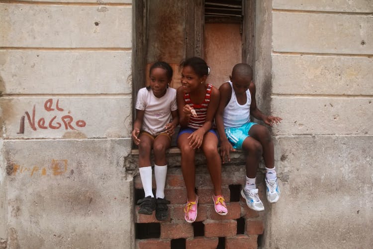 Boy And Girls Sitting Together