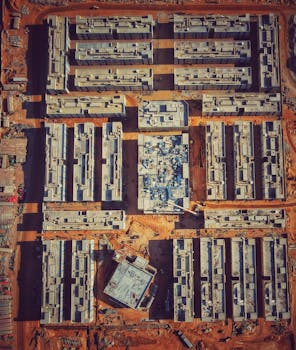 Aerial image of residential construction site in Abu Dhabi showcasing urban development.