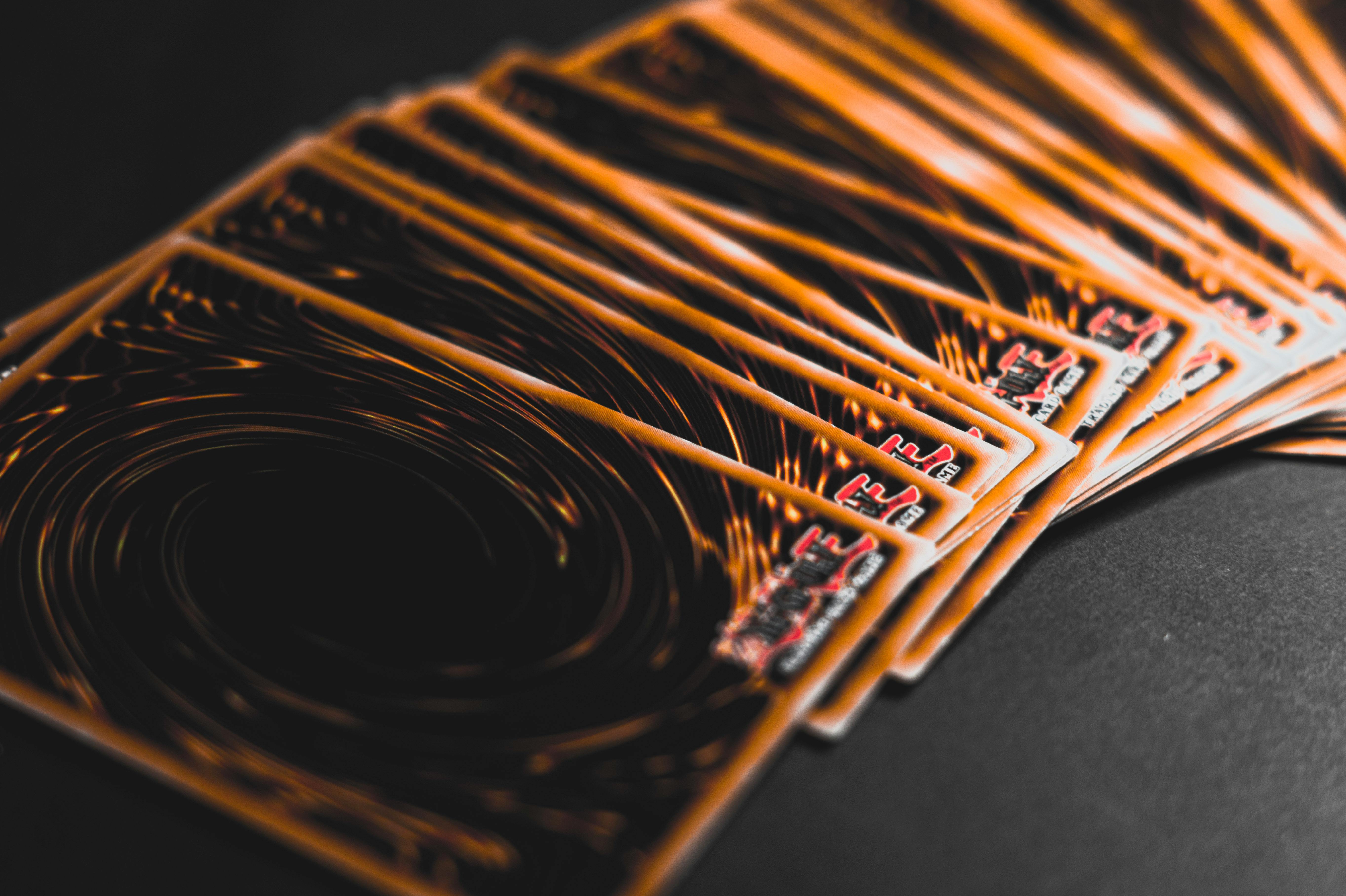 Close-up view of collectible trading cards in a fan arrangement, highlighting intricate patterns.