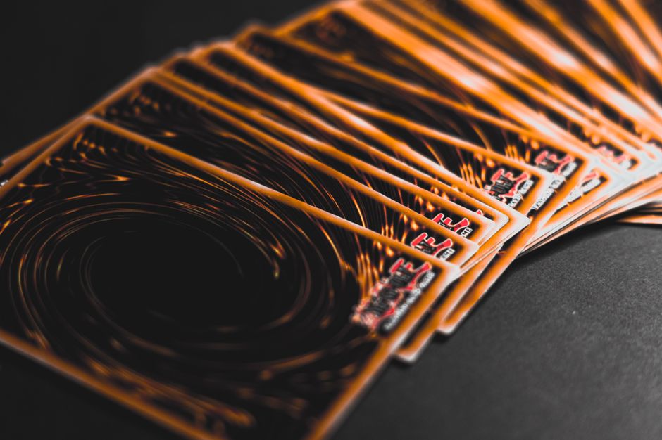 Close-up view of collectible trading cards in a fan arrangement, highlighting intricate patterns.