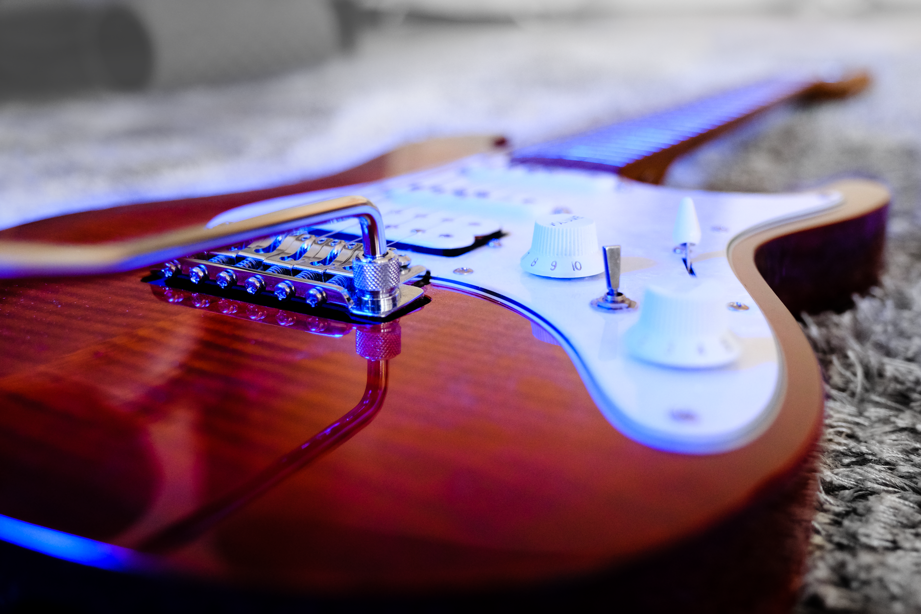 Wonderland artwork — electric guitar in vibrant light