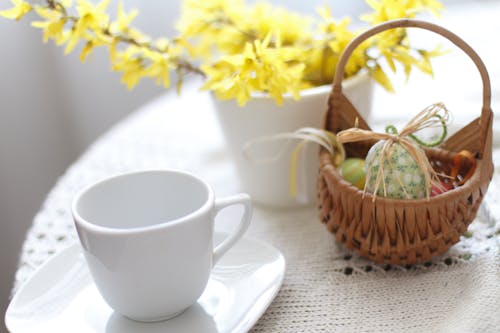 Free A Cup and Saucer on the Table with Basket Stock Photo