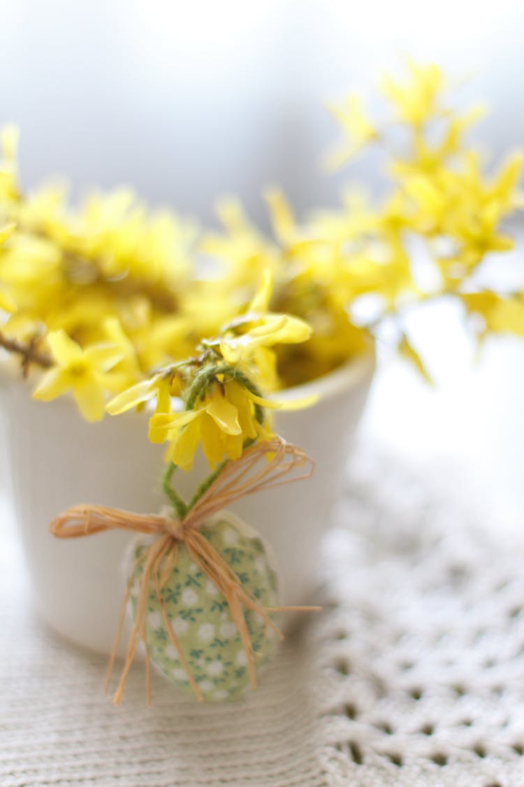 A Hanging Egg Covered With Floral Cloth 