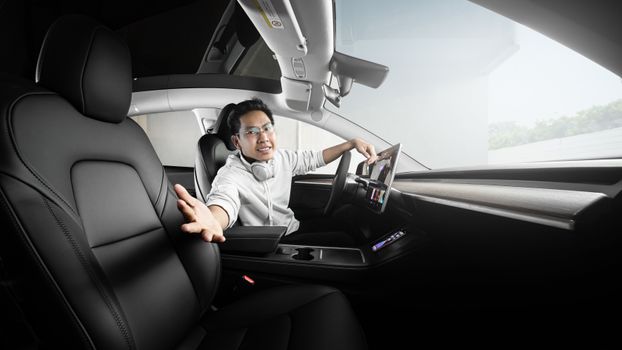 Man in Gray Dress Shirt Sitting on Car Seat