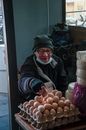 Man in Gray and Black Jacket Holding Red Apple Fruit