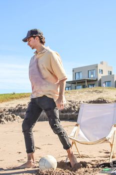 A man enjoys leisure time at Mar del Plata beach, perfect for vacation and relaxation.