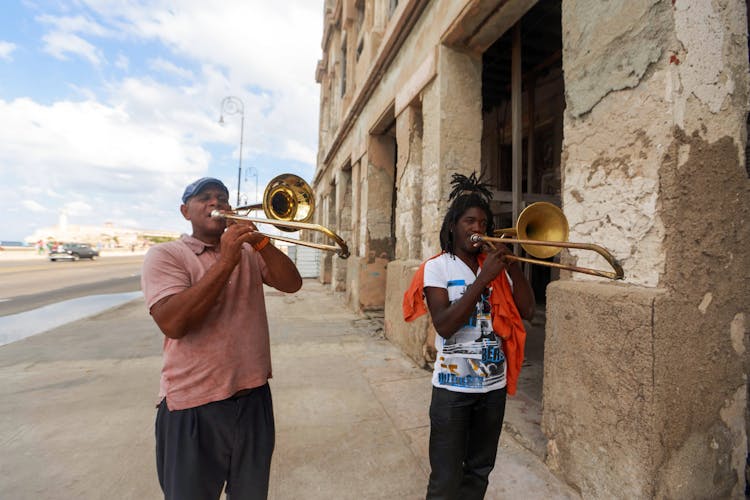 Men Playing Trumpets