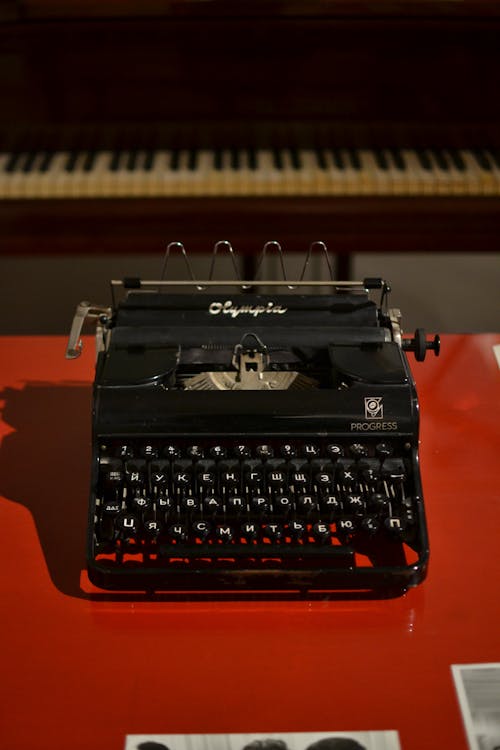 Black Typewriter on Red Table