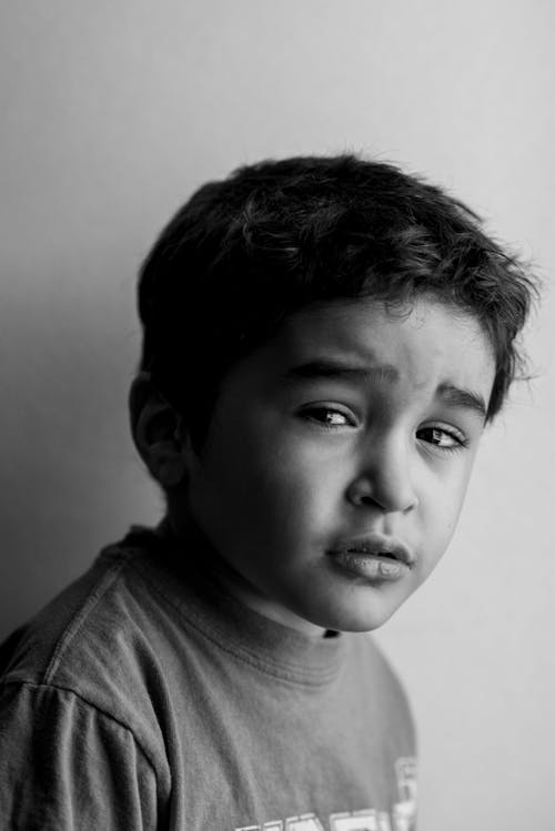 Free Grayscale Photo of Boy in Crew Neck Shirt Stock Photo