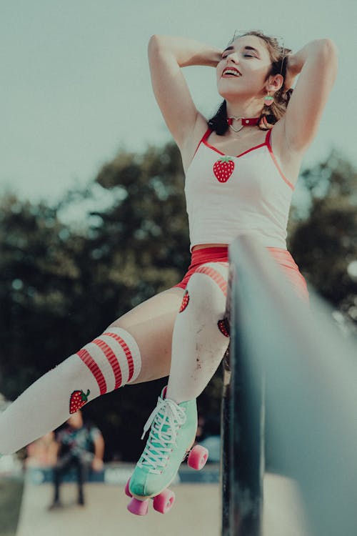 Woman Holding Her Head Wearing Roller Skates 