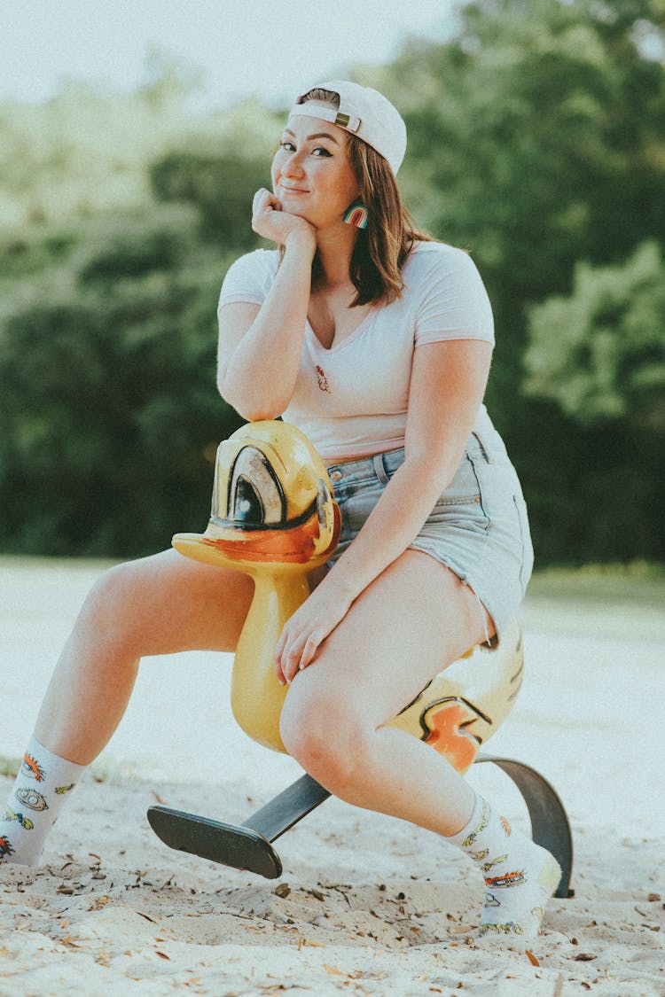 Woman Sitting On A Spring Rider