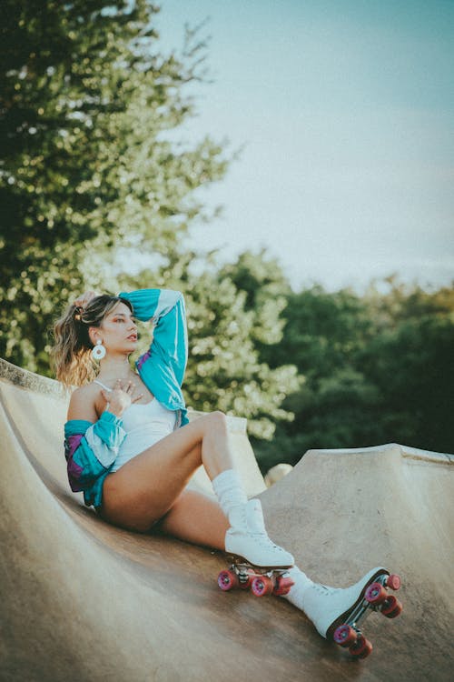 Sexy Woman Sitting on a Skate Ramp
