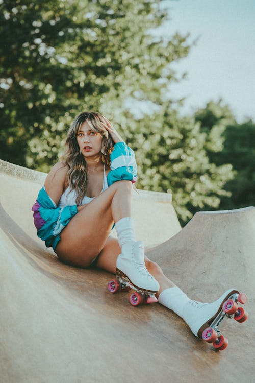 Beautiful Woman Wearing a Jacket and White Roller Skates 