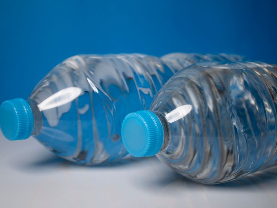 Still mineral water bottles with blue caps