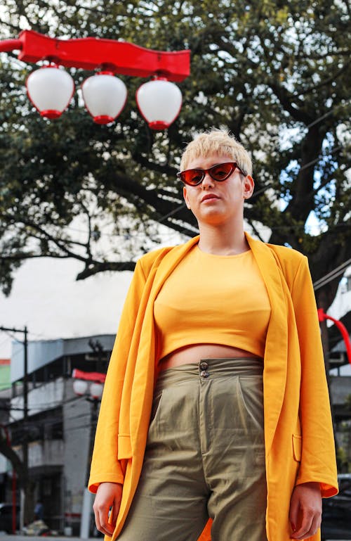 Woman in Yellow Jacket Wearing Sunglasses