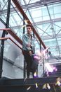 Man in Blue Jacket Standing on Stairs