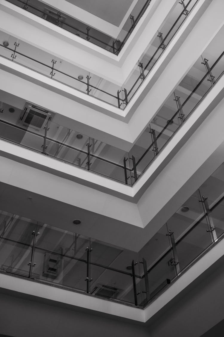 Multi-Storey Building With Glass Panels And Metal Railings