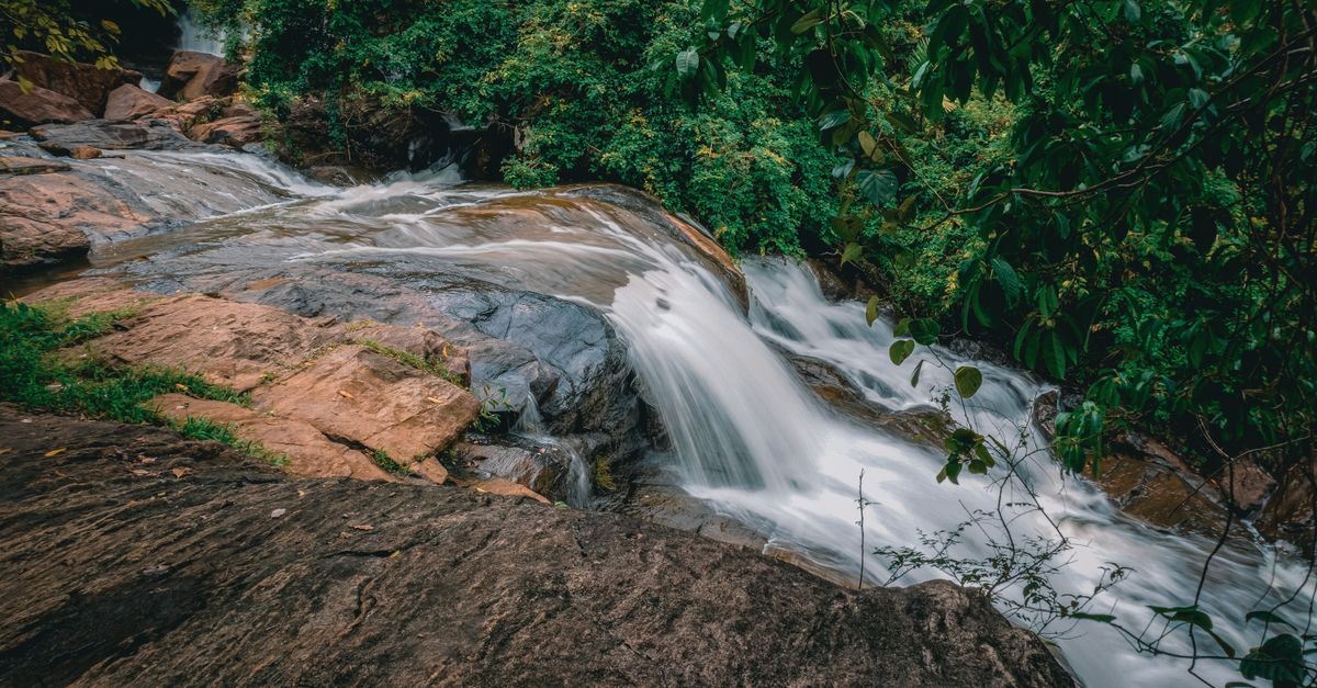 Body of Water Rushing Through Rocks · Free Stock Photo