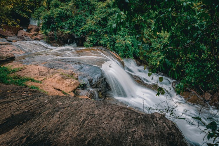 Body Of Water Rushing Through Rocks