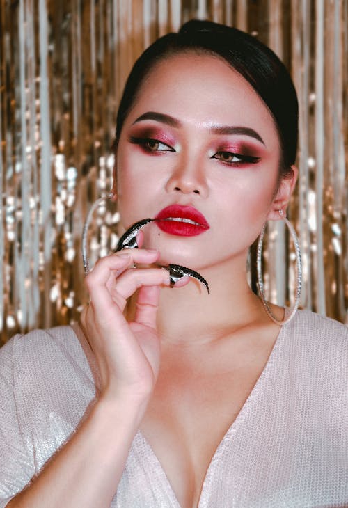 A Woman with Eyeshadow and Red Lips