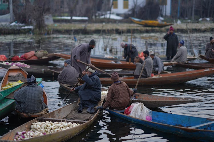 Men In Gondolas Transporting Food