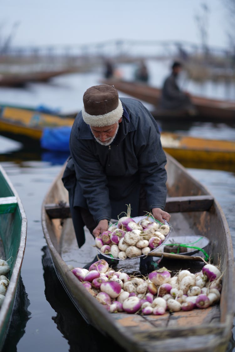 Man Selling Vegetables From Canoe