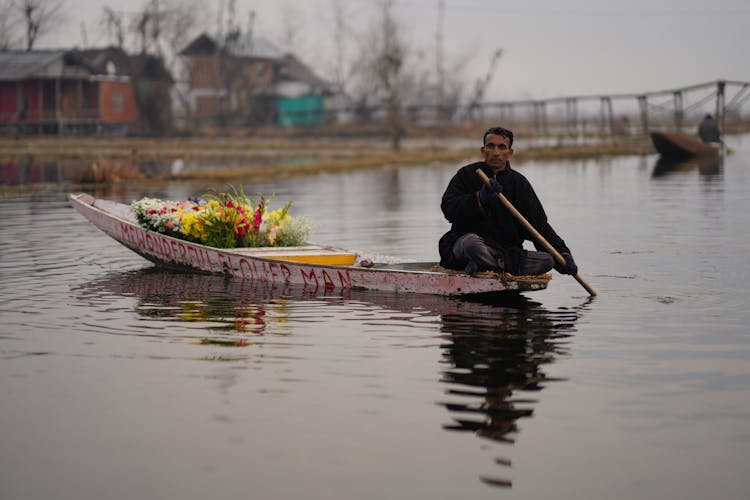 Man Selling Flowers From Boat