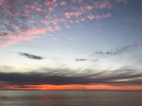 Free Stunning sunset view over the Black Sea with vibrant clouds and calm waters. Stock Photo
