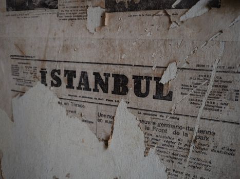 Torn Newspaper on Wall