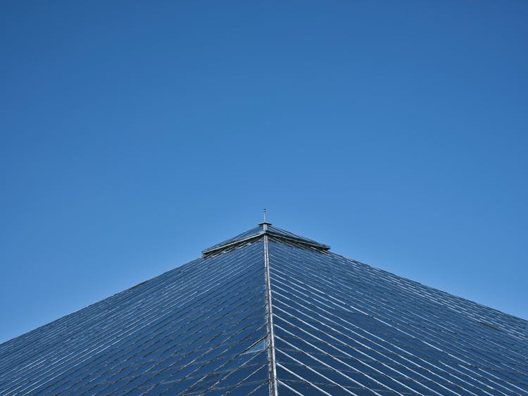 Modern Building Glass Roof On Blue Sky