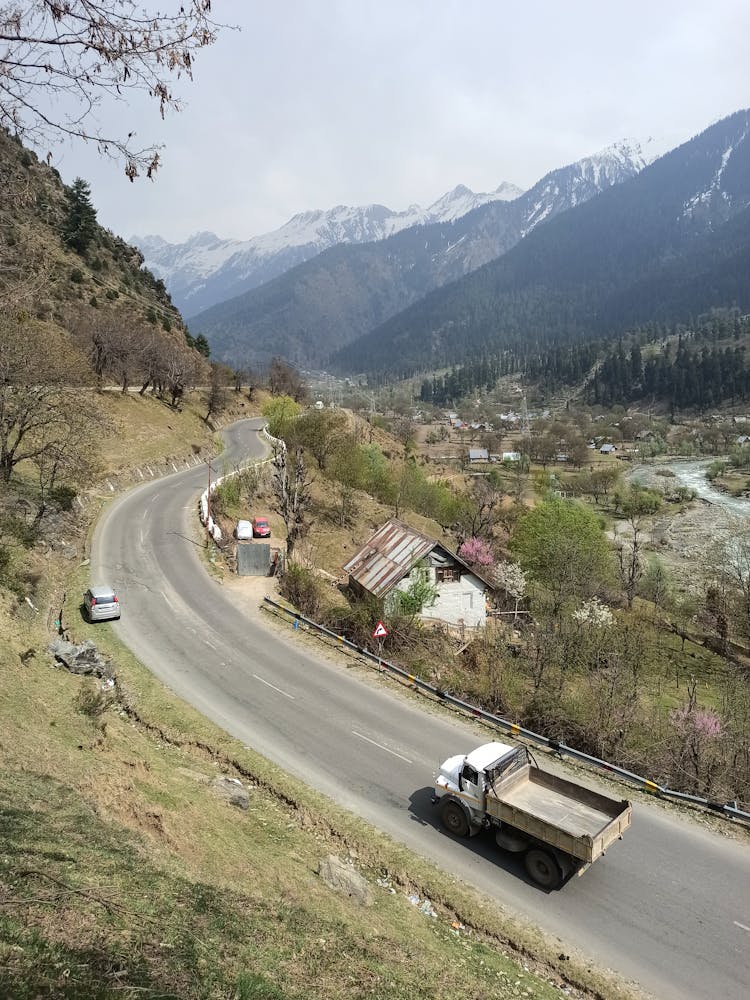 Truck Driving On Asphalt Road