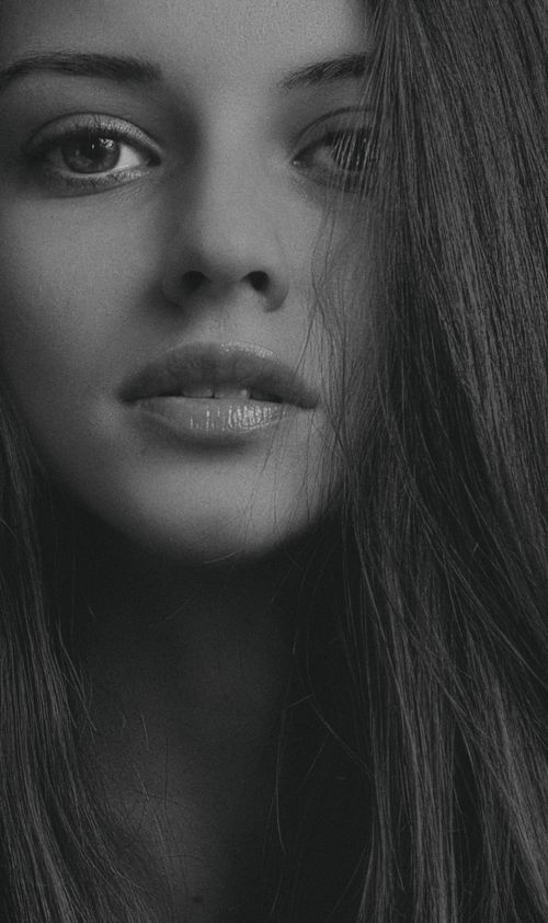 Free Sophisticated close-up black and white portrait of a young woman. Stock Photo