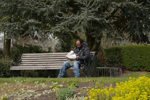 reading newspaper at park