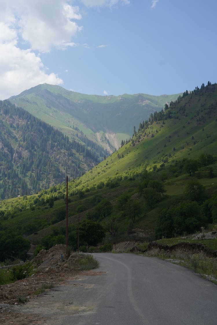 Empty Road In Mountains Landscape