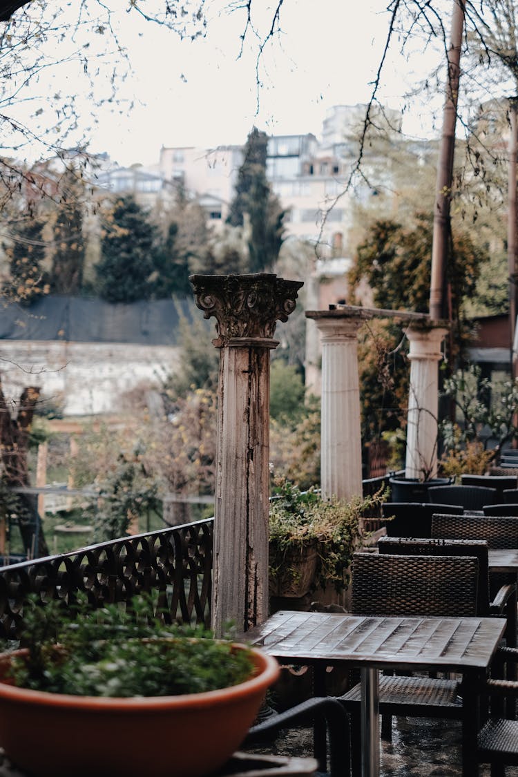 Cafe Tables On Outdoor Terrace With Columns