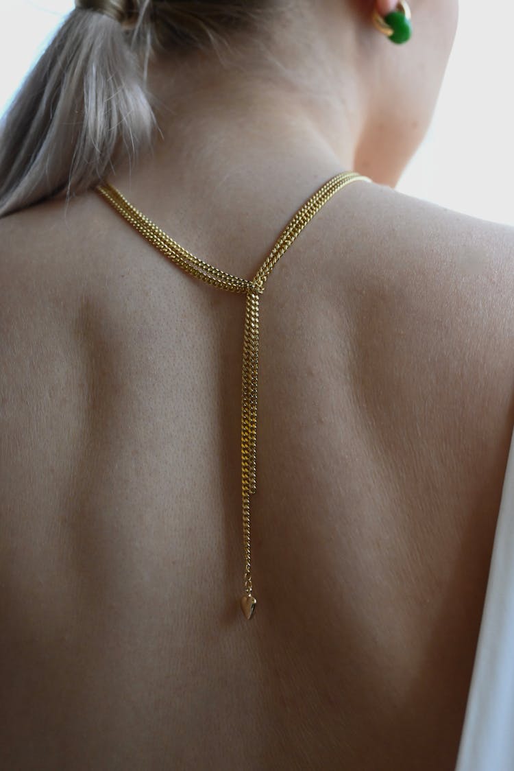 Back Of A Woman Wearing Neck Chain