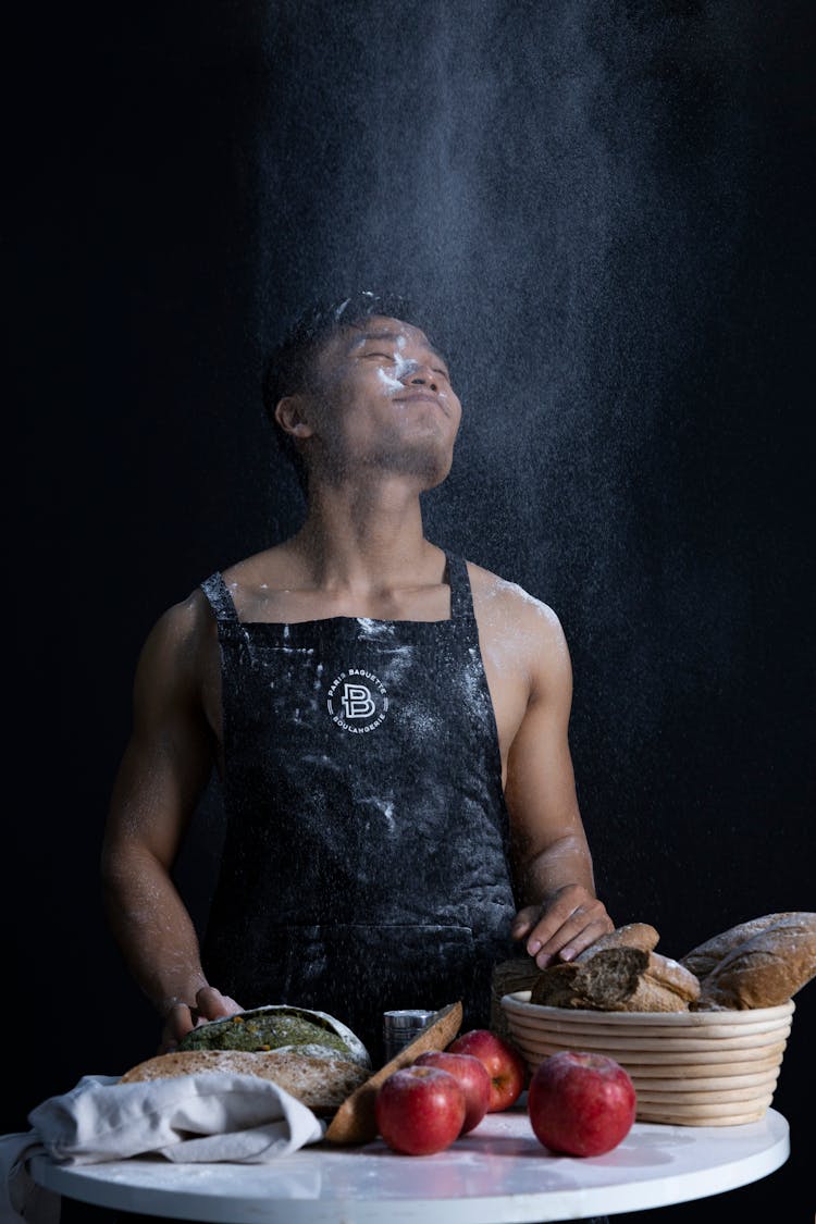 Man In Black Apron Baking