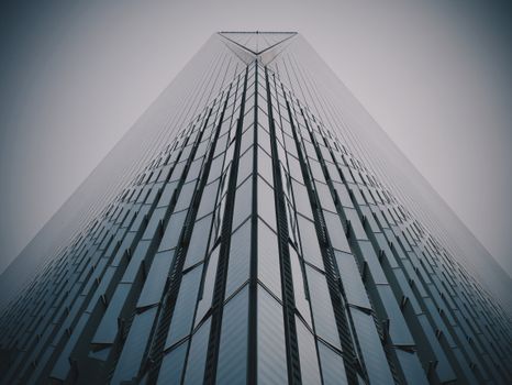 A modern skyscraper with glass facade under a gloomy sky, captured from a low angle for dramatic effect.