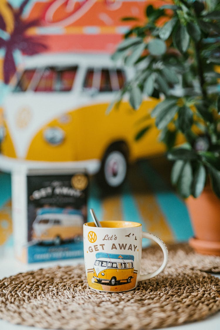 Mug With Picture Of Camper With Poster Of Camper In Background