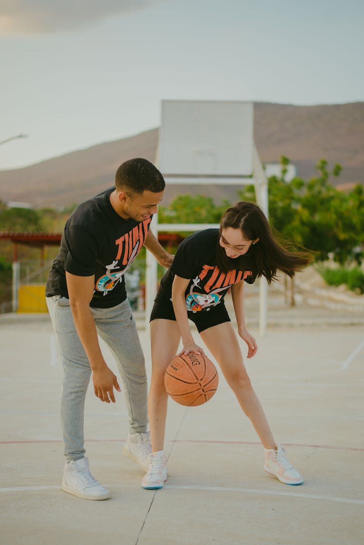 Happy Couple Playing Basketball