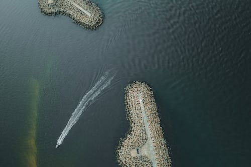 Top View of a Boat Sailing near the Docks