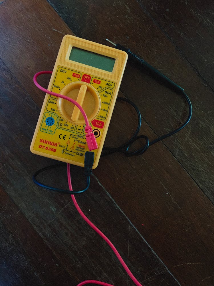 Digital Multimeter On Wooden Table