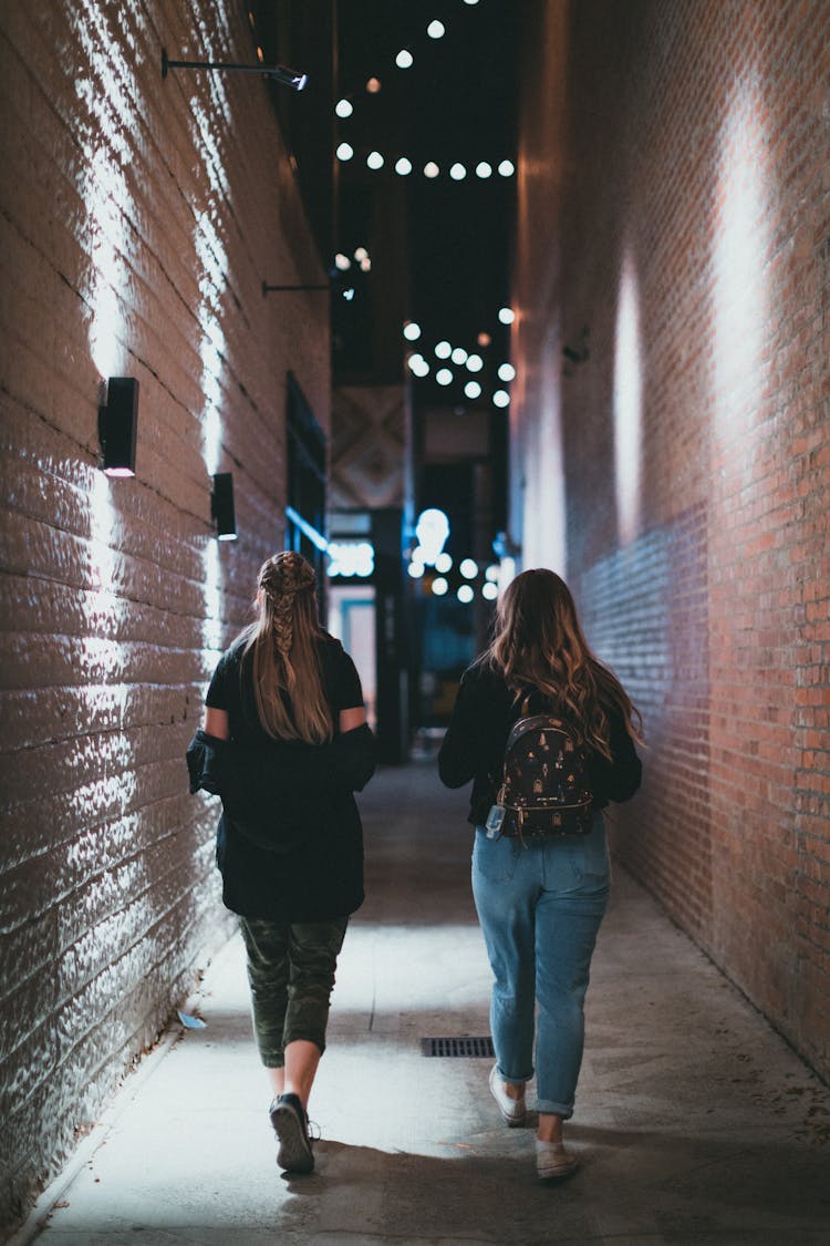 Teenage Girls Walking City Alley At Night