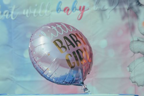 Free Pink balloon with 'little baby girl' text, perfect for baby showers or gender reveal parties. Stock Photo