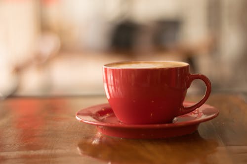 Free Red Ceramic Mug on Red Saucer Stock Photo